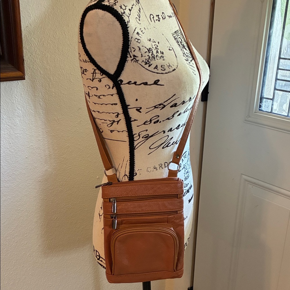 Camel/rust colored Crossbody Bag-strap is adjustable